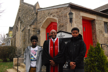 Rev. Evans in front of Mt. Zion Baptist Church with church youth