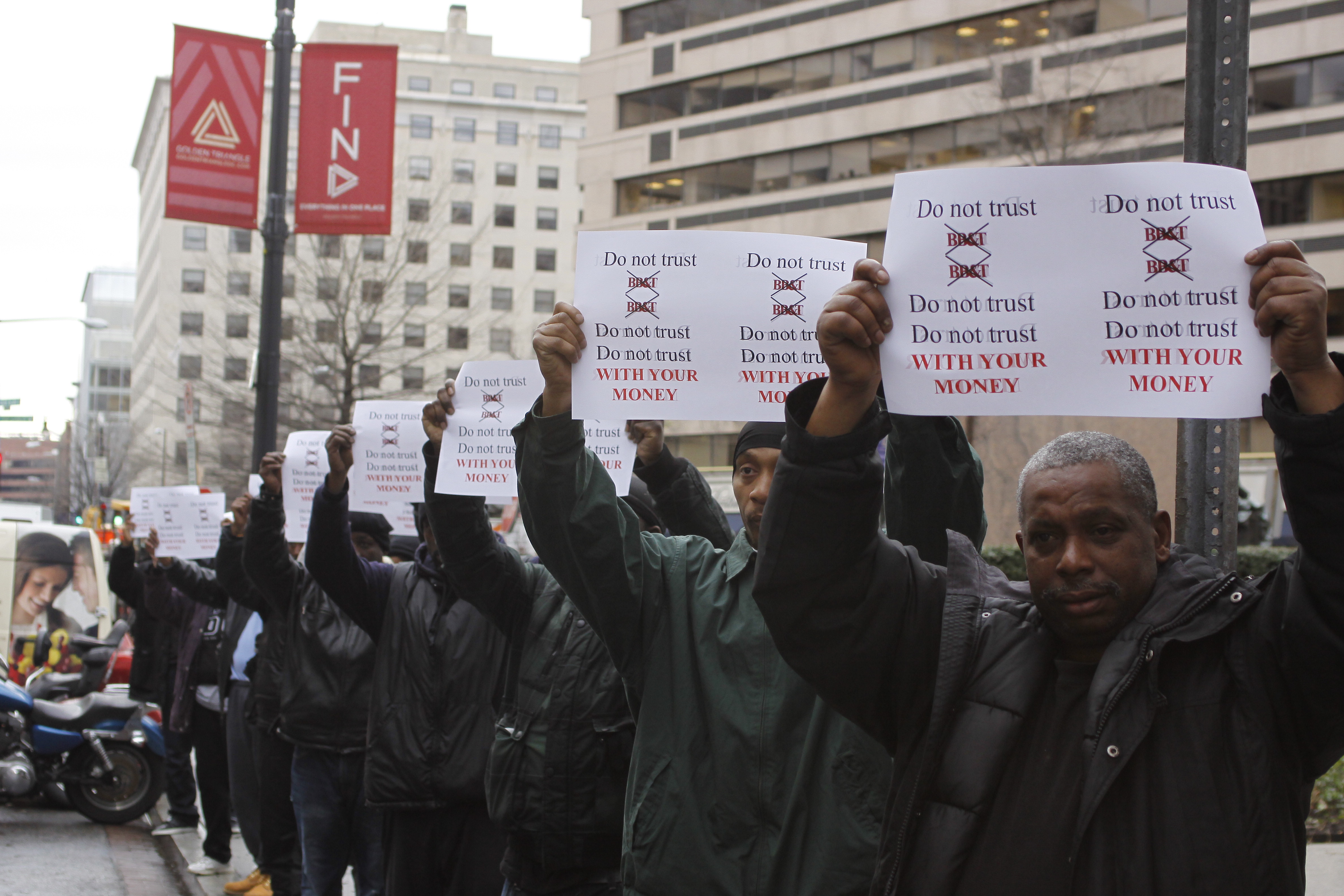 Men demonstrating in front of BB&T bank in Washington, DC