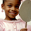 Beautiful child looking at mirror