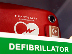 Emergency defibrillator in a glass enclosed case
