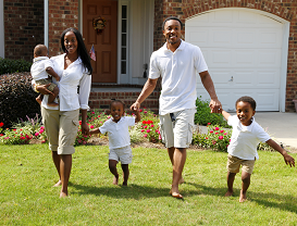 Black family in front of their house